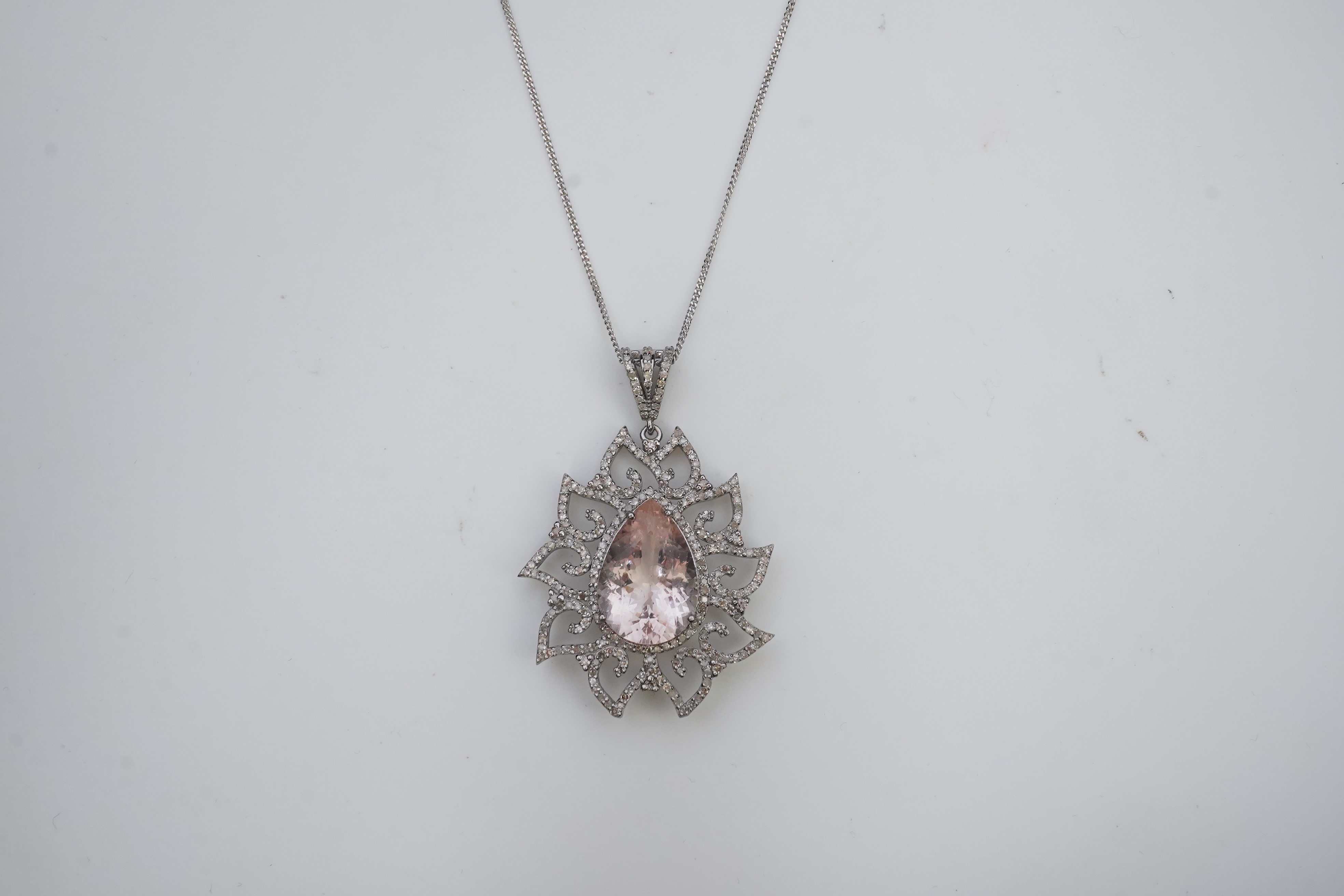 A morganite and diamond pendant